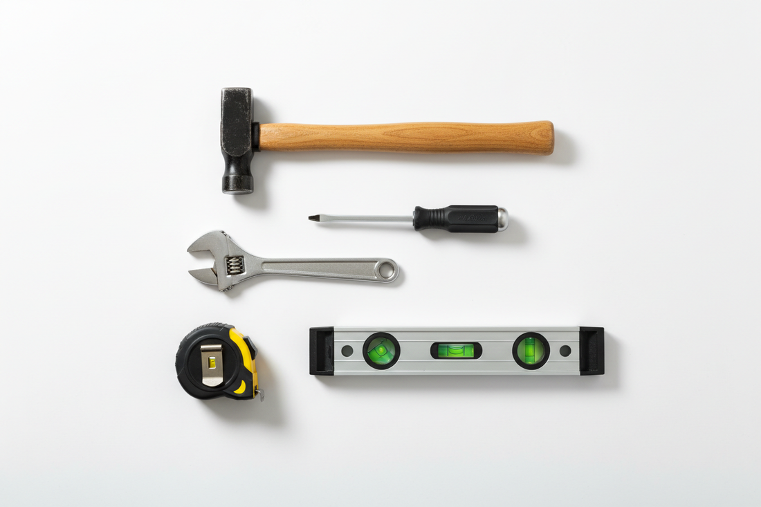 Professional construction tools — hammer, screwdriver, wrench, tape measure and spirit level
